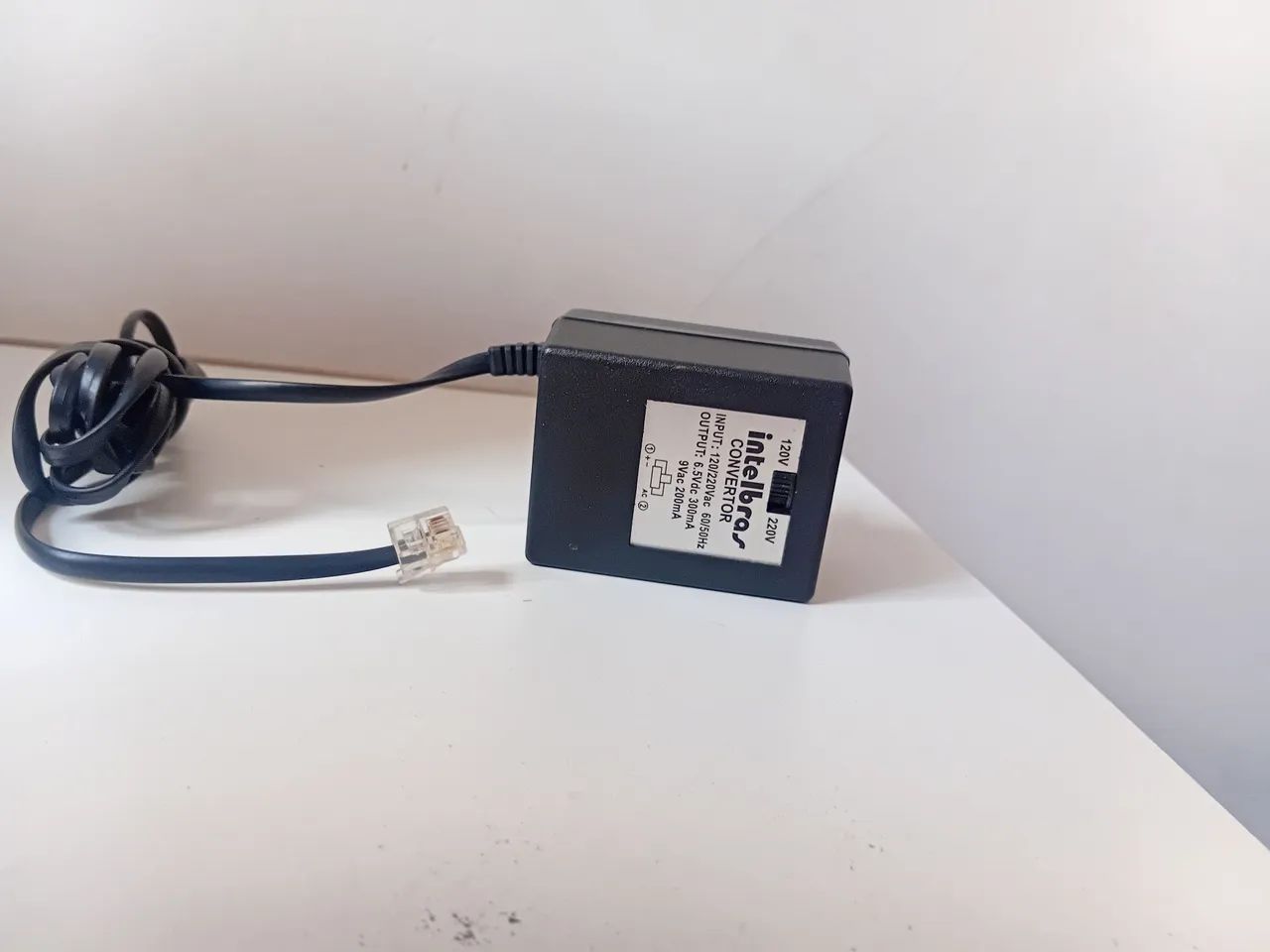 adaptador AC da marca Intelbras.  - Foto 5