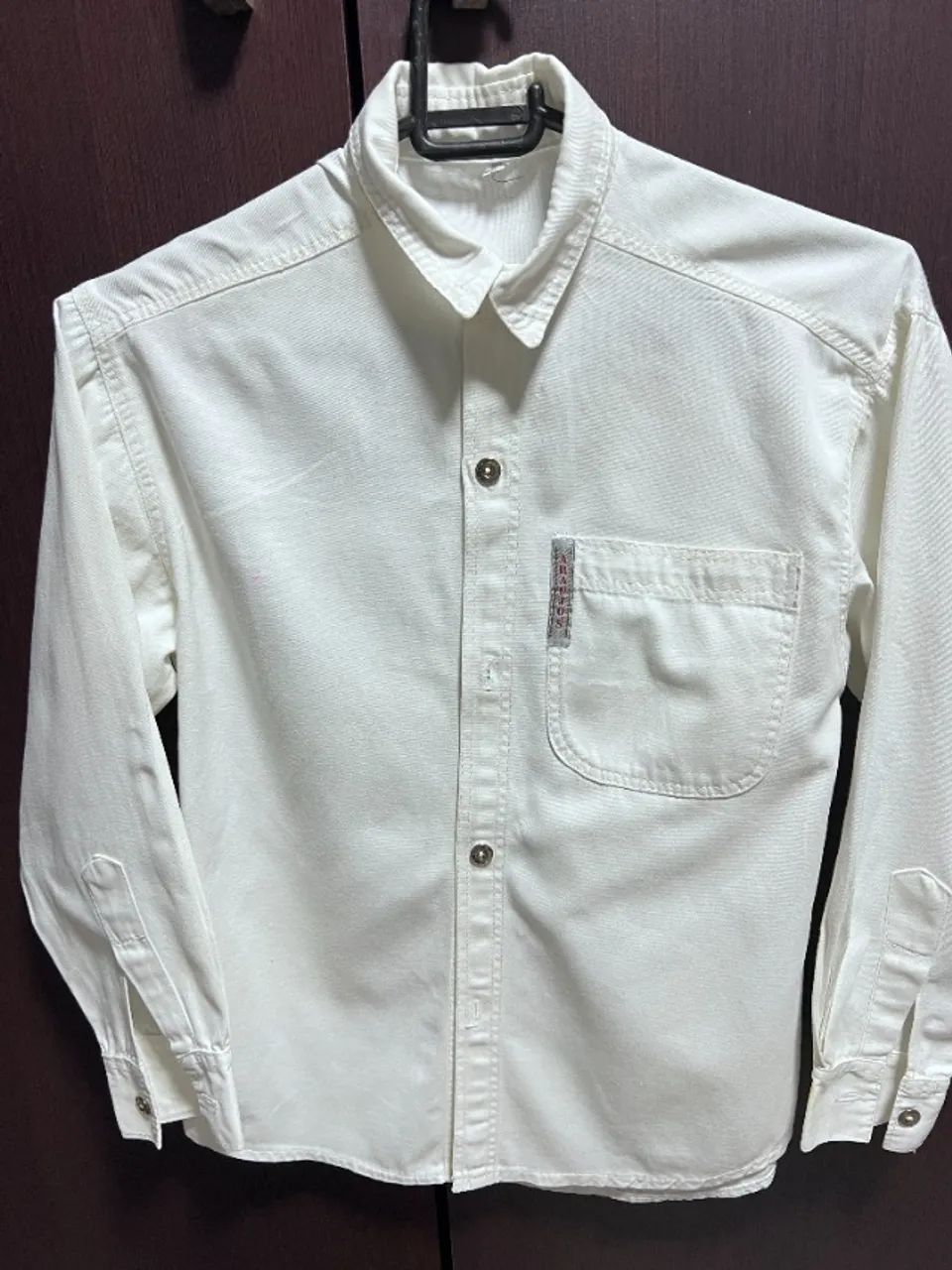 Camisa tamanho  M = 8 anos