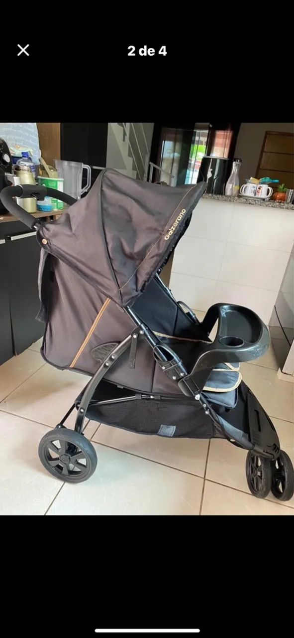 Carrinho de bebê com bebê conforto 