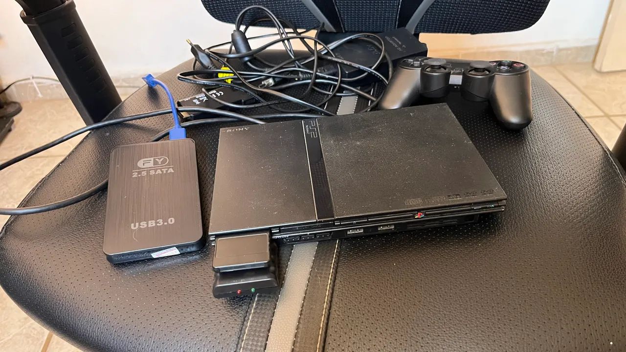PlayStation 2 com leitor de disco funcionando 