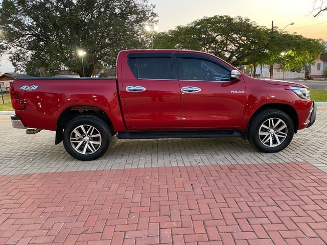 HILUX SRX AUT. 2.8 TDI VERMELHA PASSO DÍVIDA.