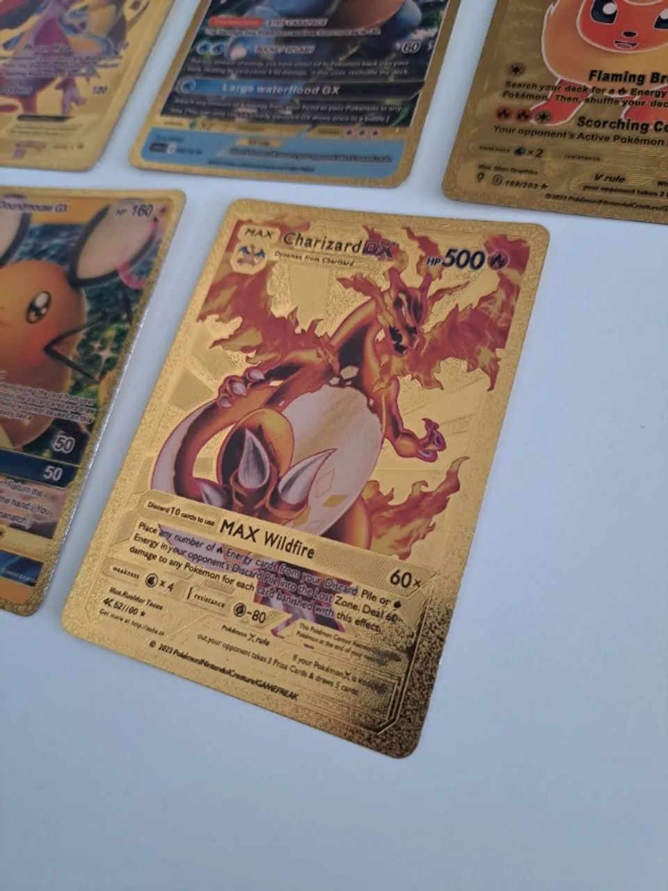 6 cartas pokemon dourada e gx - Foto 4