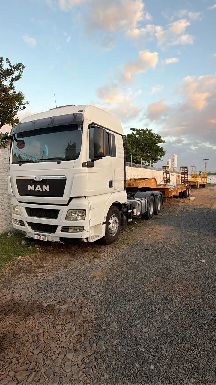 Caminhão traçado man com prancha 