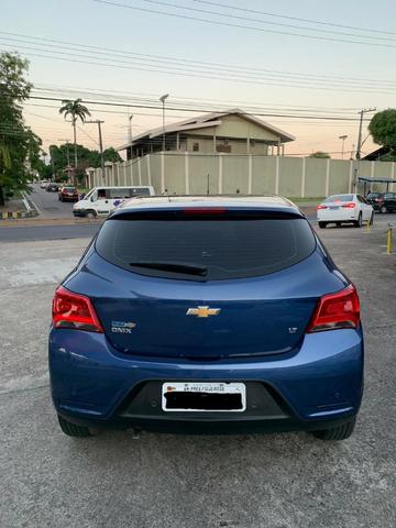 Onix modelo novo lt com my link 10 mil de entrada - Foto 8