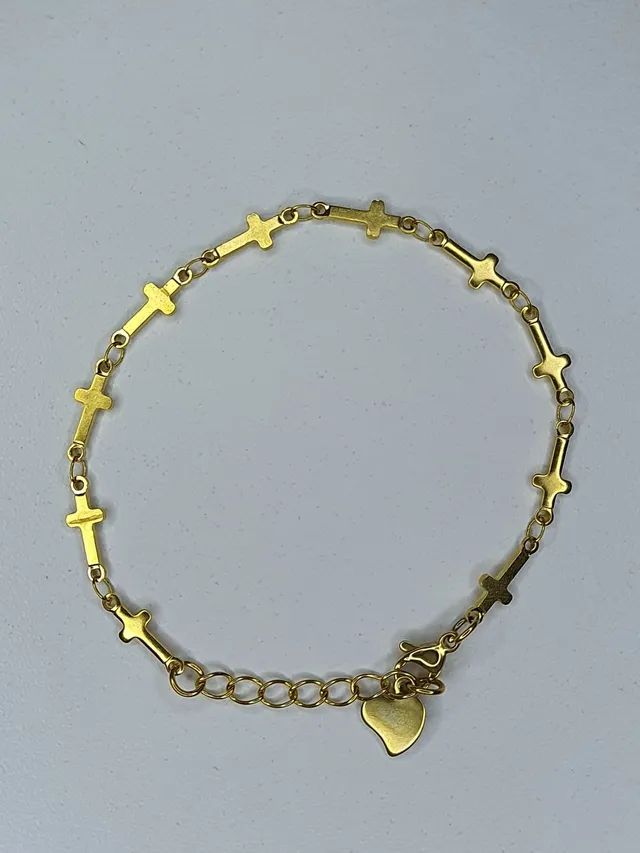 Pulseira dourada trançada ou cruz