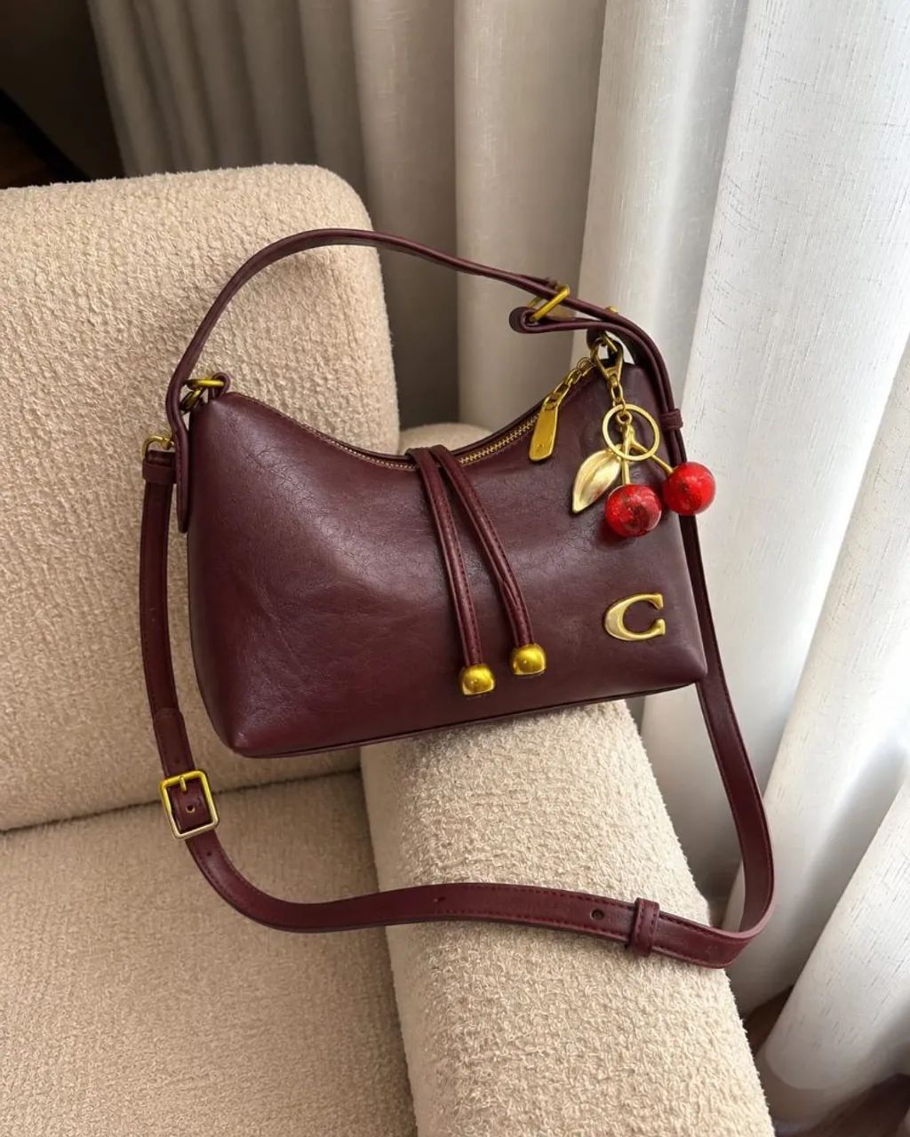 Bolsa Coach com chaveiro 