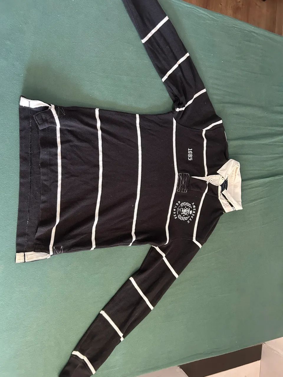 Polo tommy manga longa