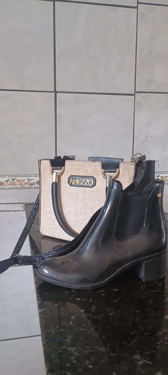 Bolsa as Rezzo e bota preta p chuva e frio