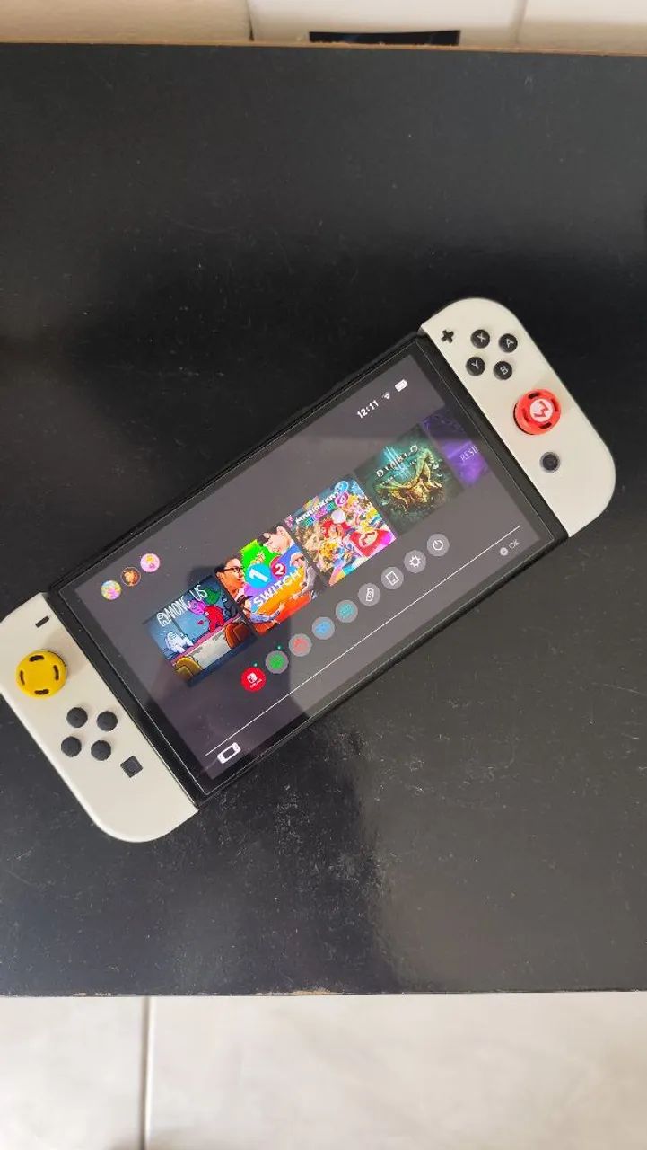 Nintendo switch oled 64gb na caixa com 4 joycons e acessorios - Foto 4