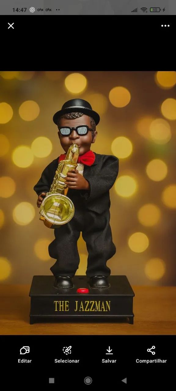 BONECO QUE DANÇA E TOCA JAZZ