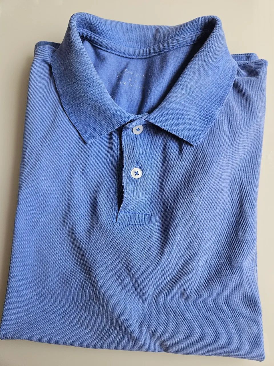 Camisa polo azul claro 
