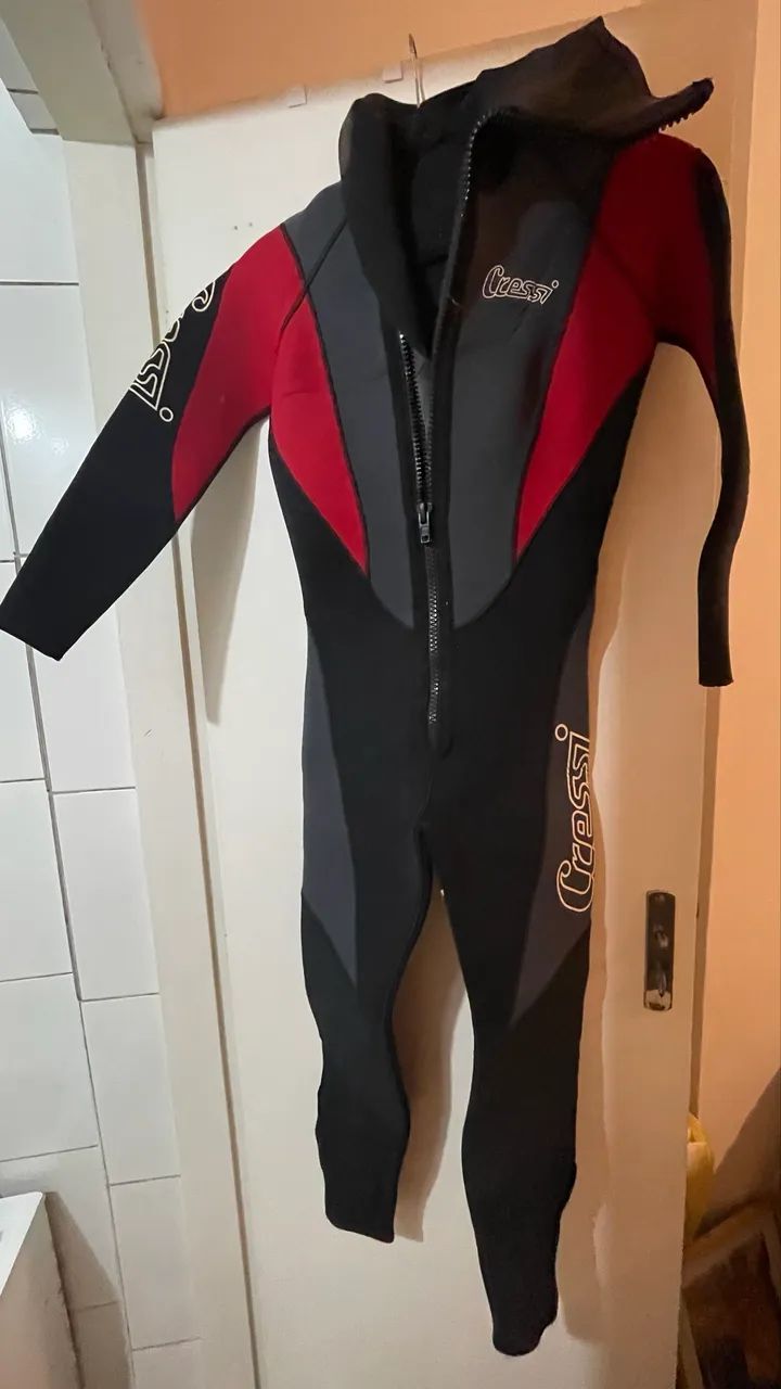 Diving suit, fins, and dive bag