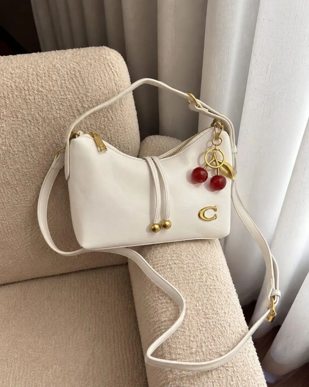 Bolsa Coach com chaveiro 