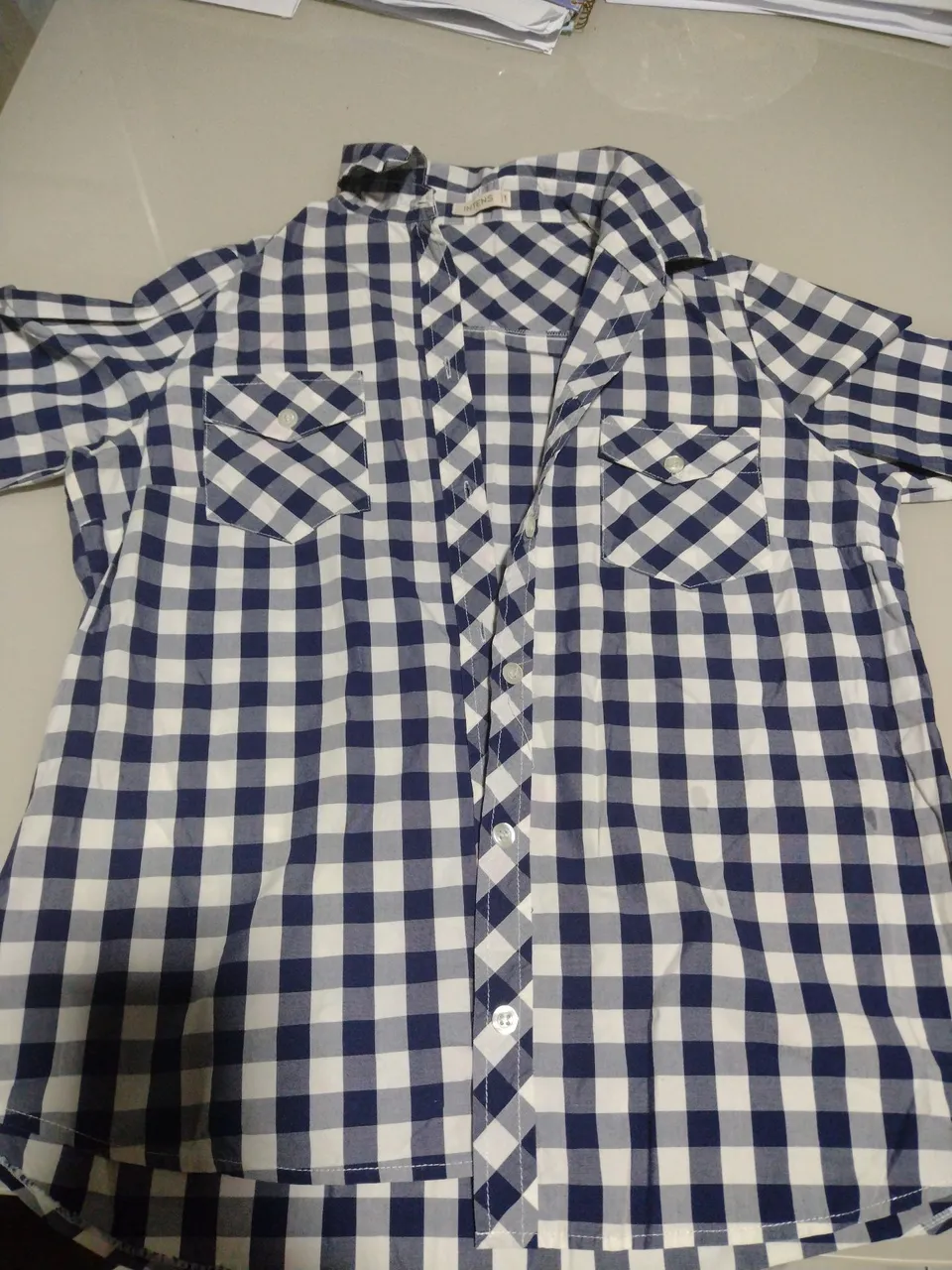 Camisa xadrez azul e branca