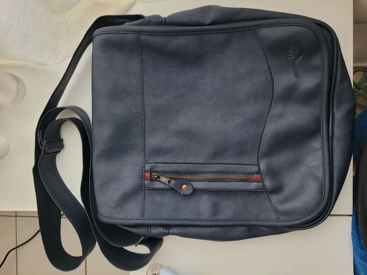 Bolsa estilo carteiro da Taco