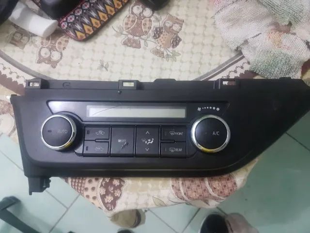 Moldura Comando do ar condicionado Corolla Altis. Aceito Cartão.