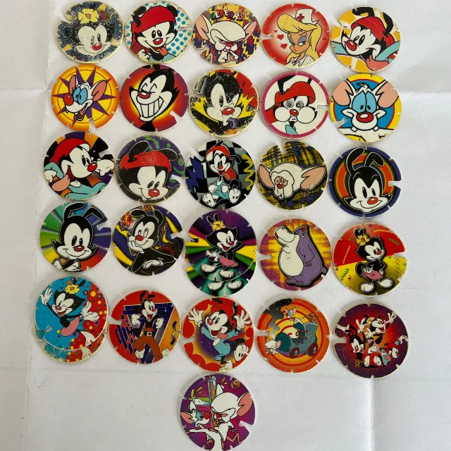 26 Tazos Animaniacs ElmaChips Série Arma E Voa com 26 unidades + 02 repetidas