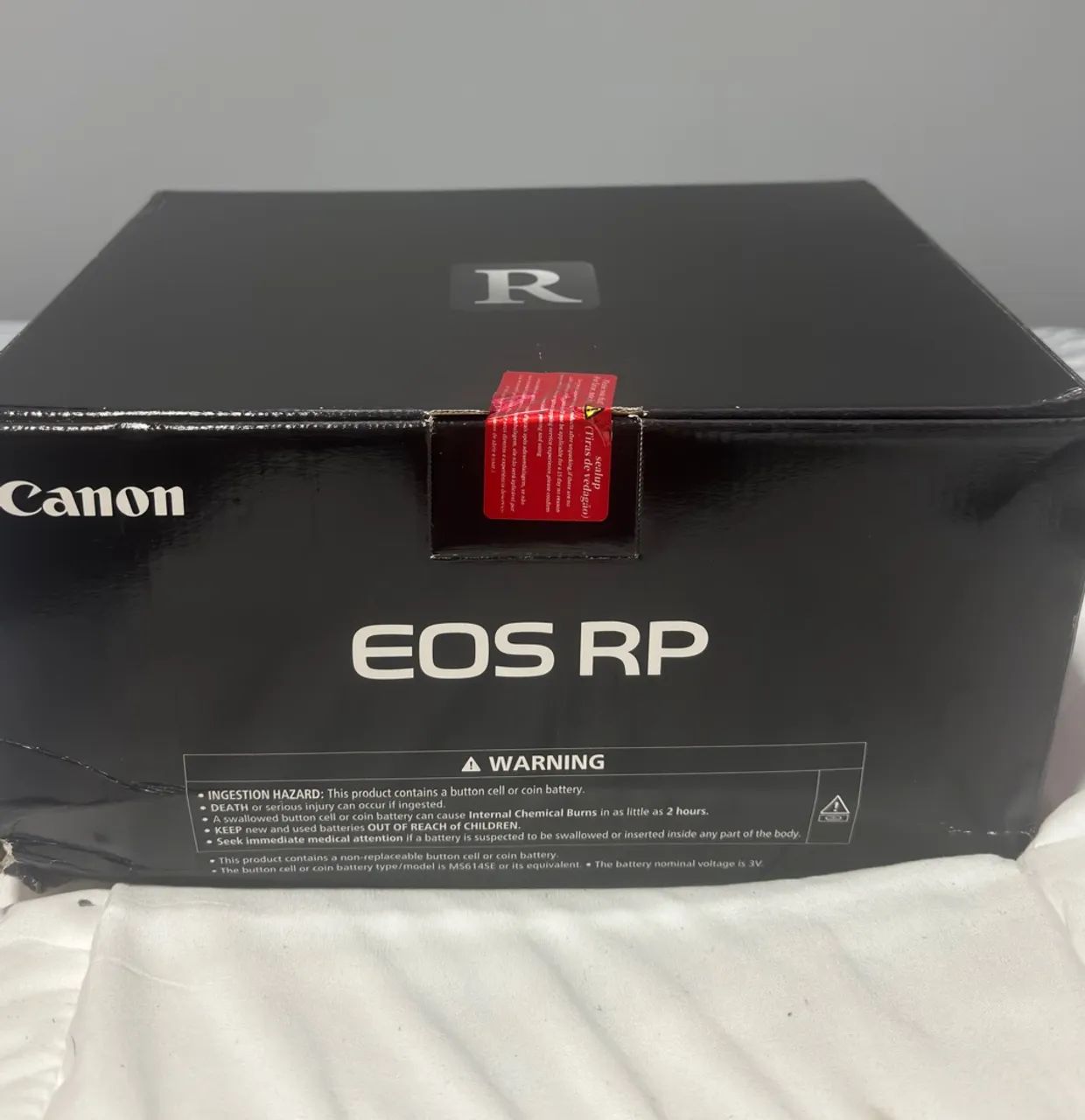 Canon RP na caixa e Lacrada