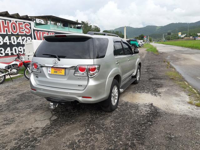 Toyota hilux sw4 sr top flex com gnv ano 2014 - Foto 7