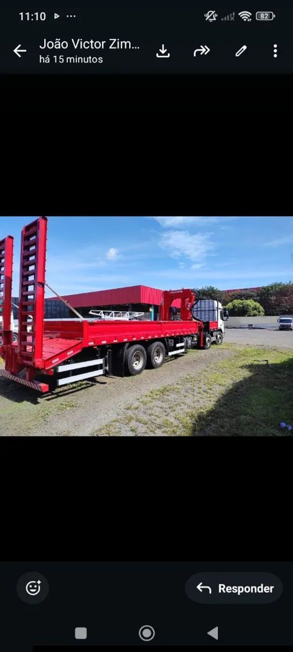 Munck 22,5 ton com carroceria com rampa hidraulica 