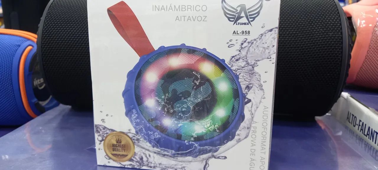 Caixa de som Bluetooth redonda com alça. Iluminação RGB 
