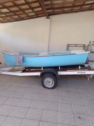 Barco de fibra com motor e carrocinha 