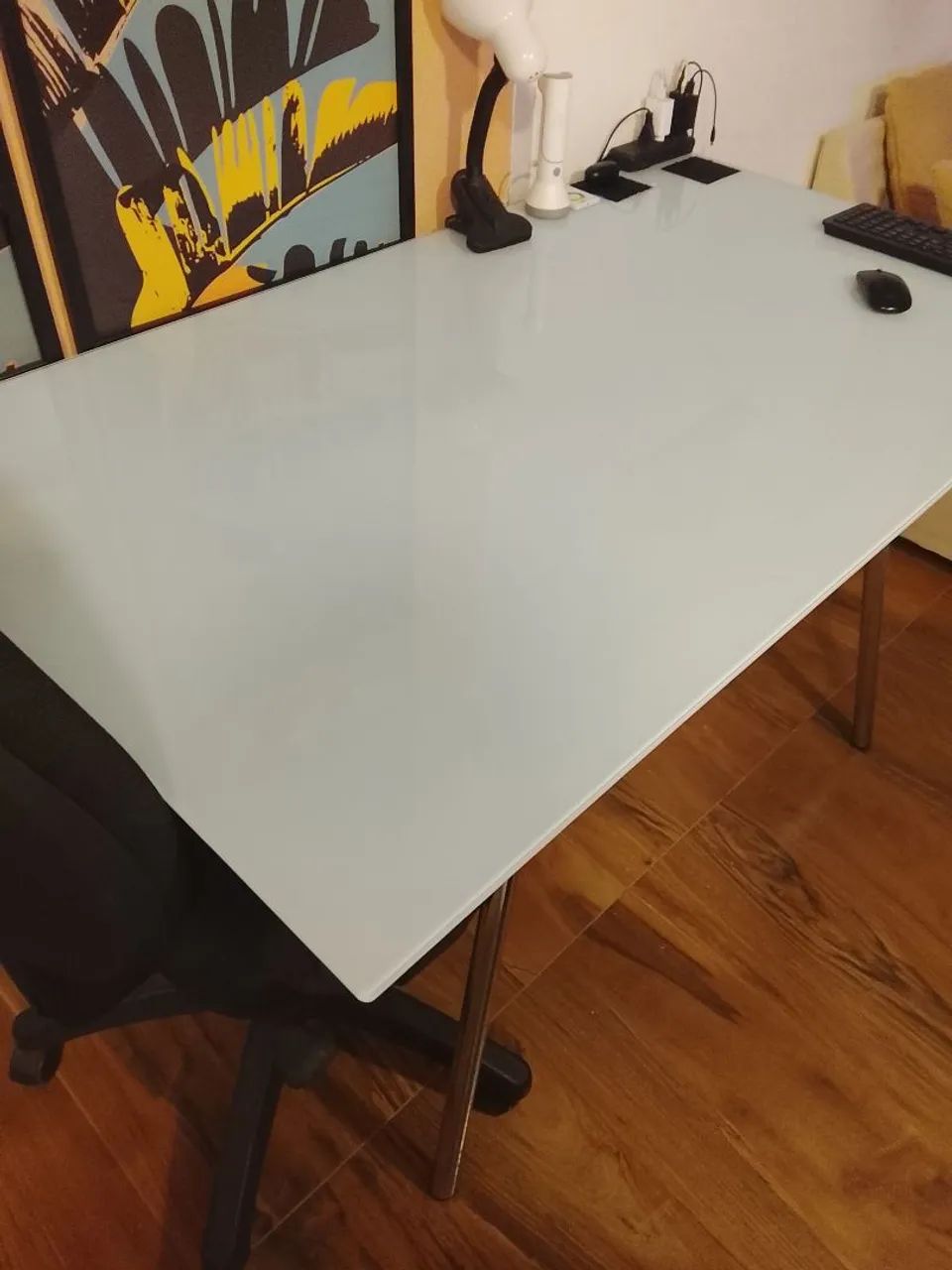 Glass desk with white film, chrome base, and MDF with small broken corner