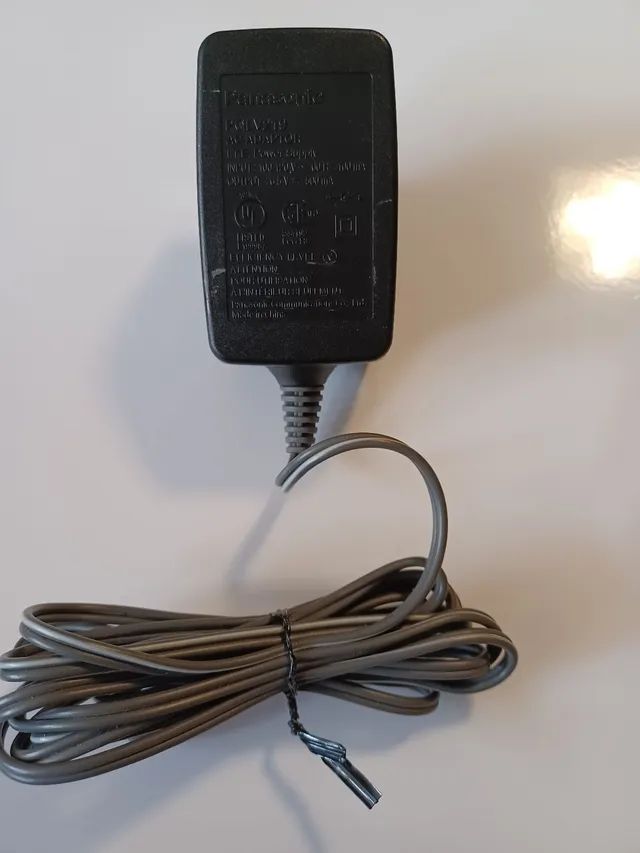 Adaptador Panasonic PQWATC1468LB. Descrição: Input 110V ~ 60Hz 50uA. Output 9V --- 200uA