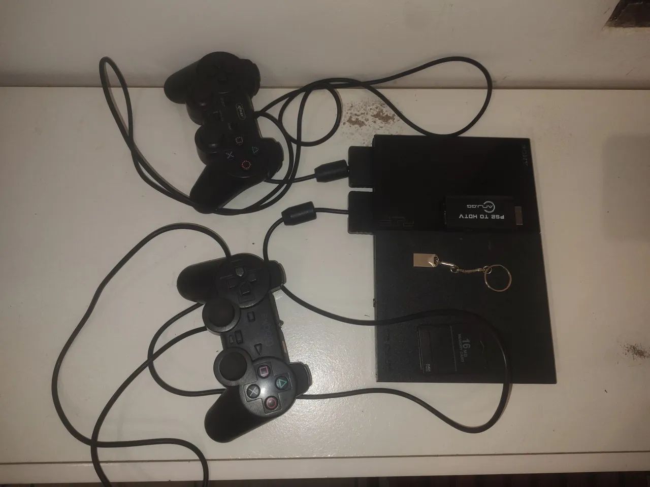 PS2 slim desbloqueado com o leitor 
