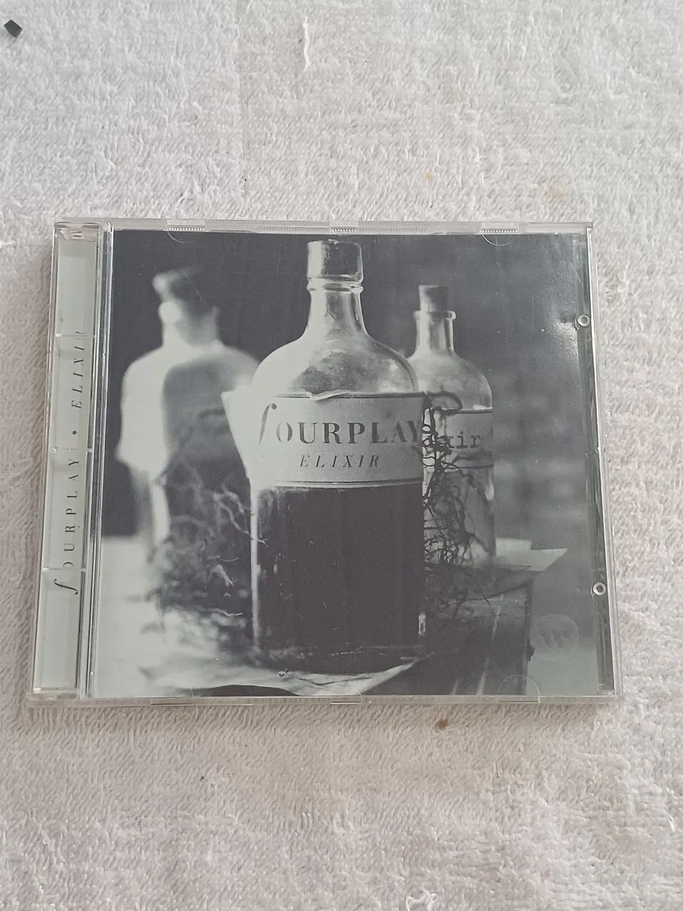 CD do álbum Elixir da banda de jazz Fourplay