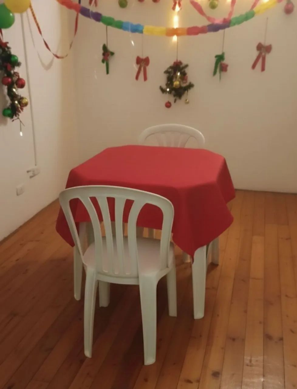 Table with two chairs and tablecloth64595960306178120