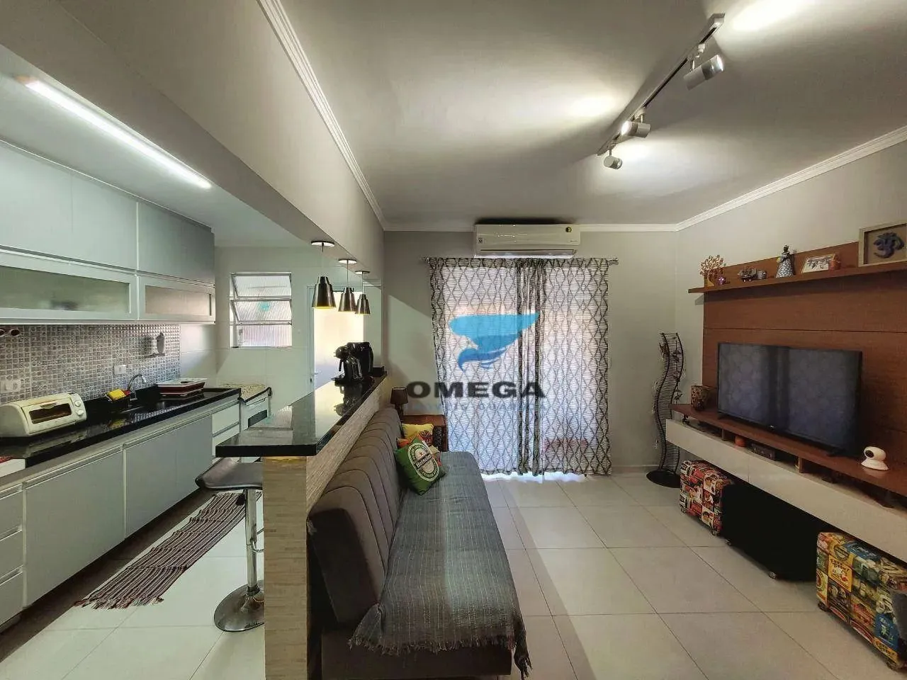 Apartamento à venda na praia do Tombo em Guarujá | Omega Imóveis