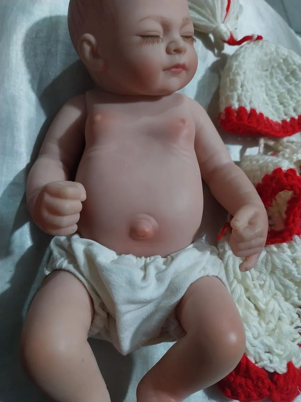 Bebê Reborn Mini 27 cm- roupinha de croche feita a mão  - Foto 4