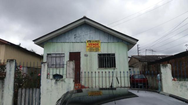 Terreno com casa de madeira no Capão Raso