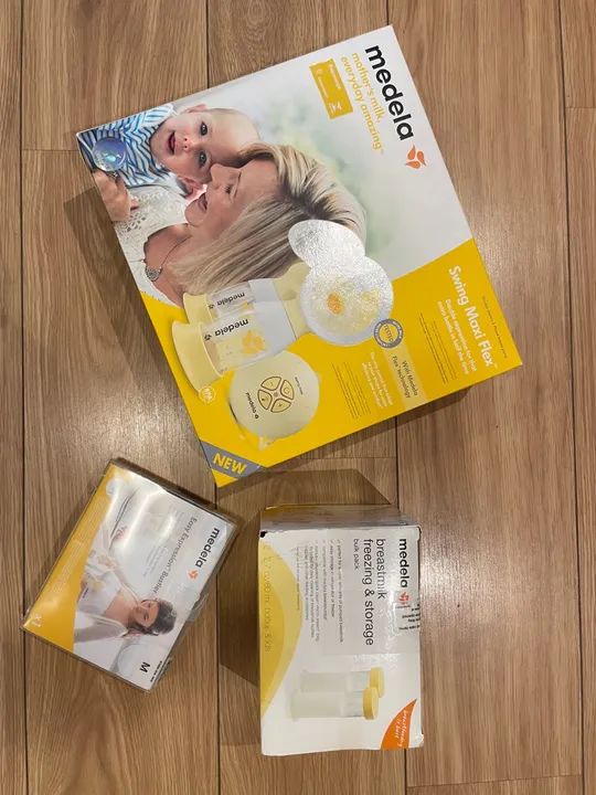 Extrator de leite duplo, sutiã e frascos da Medela