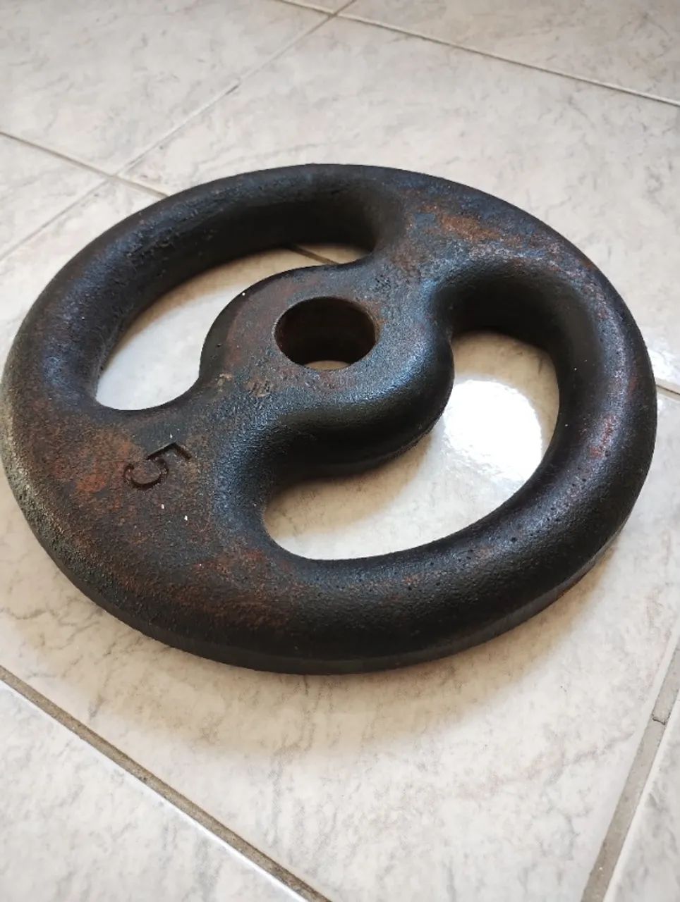 2 Anilhas 5 kg cada.