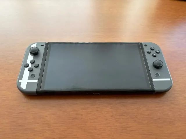 Nintendo Switch OLED Edição Smash Bros + Case + Cartão de Memória 64GB