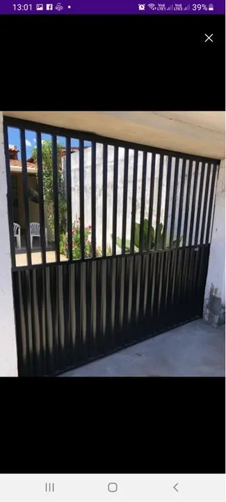 Portões em chapa reforçada com social para garagem. - Foto 5
