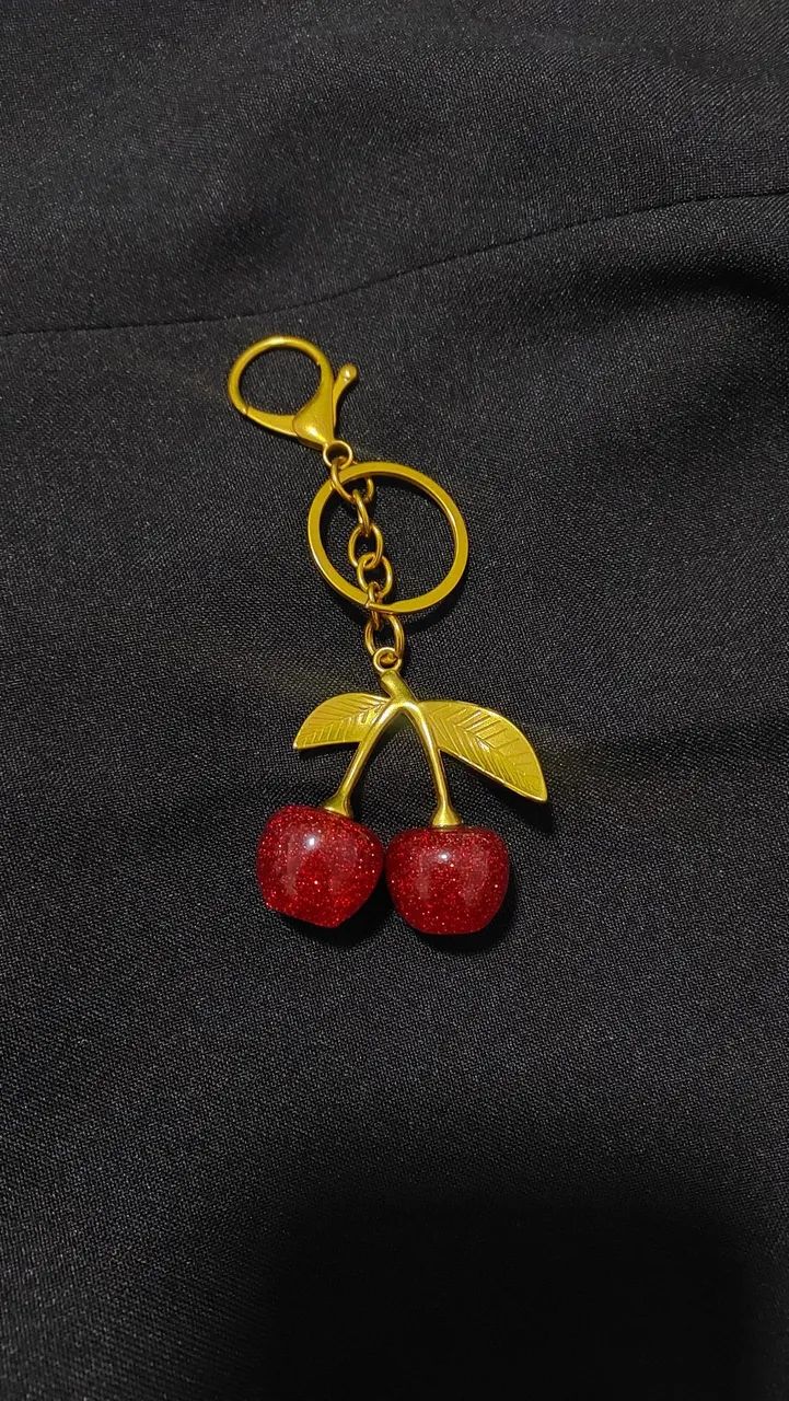 Chaveiro dourado de cereja brilhante ?
