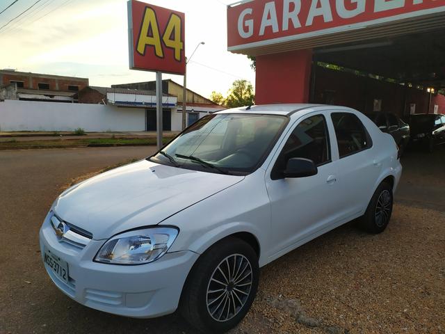 Prisma Maxx 2010/2010 Branco 4 Portas