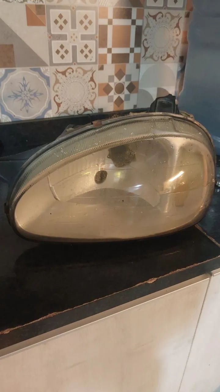 Farol corsa classic lado motorista/esquerdo