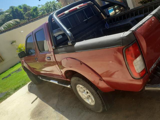 Vendo ou troco uma Frontier 2003 preferência na troca numa estrada