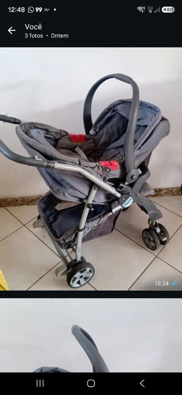Carrinho bebê com bebê e conforto.