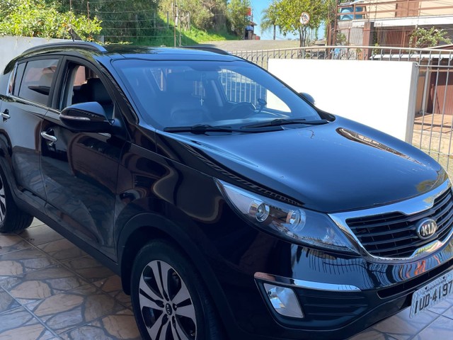 KIA SPORTAGE COMPLETA COM TETO