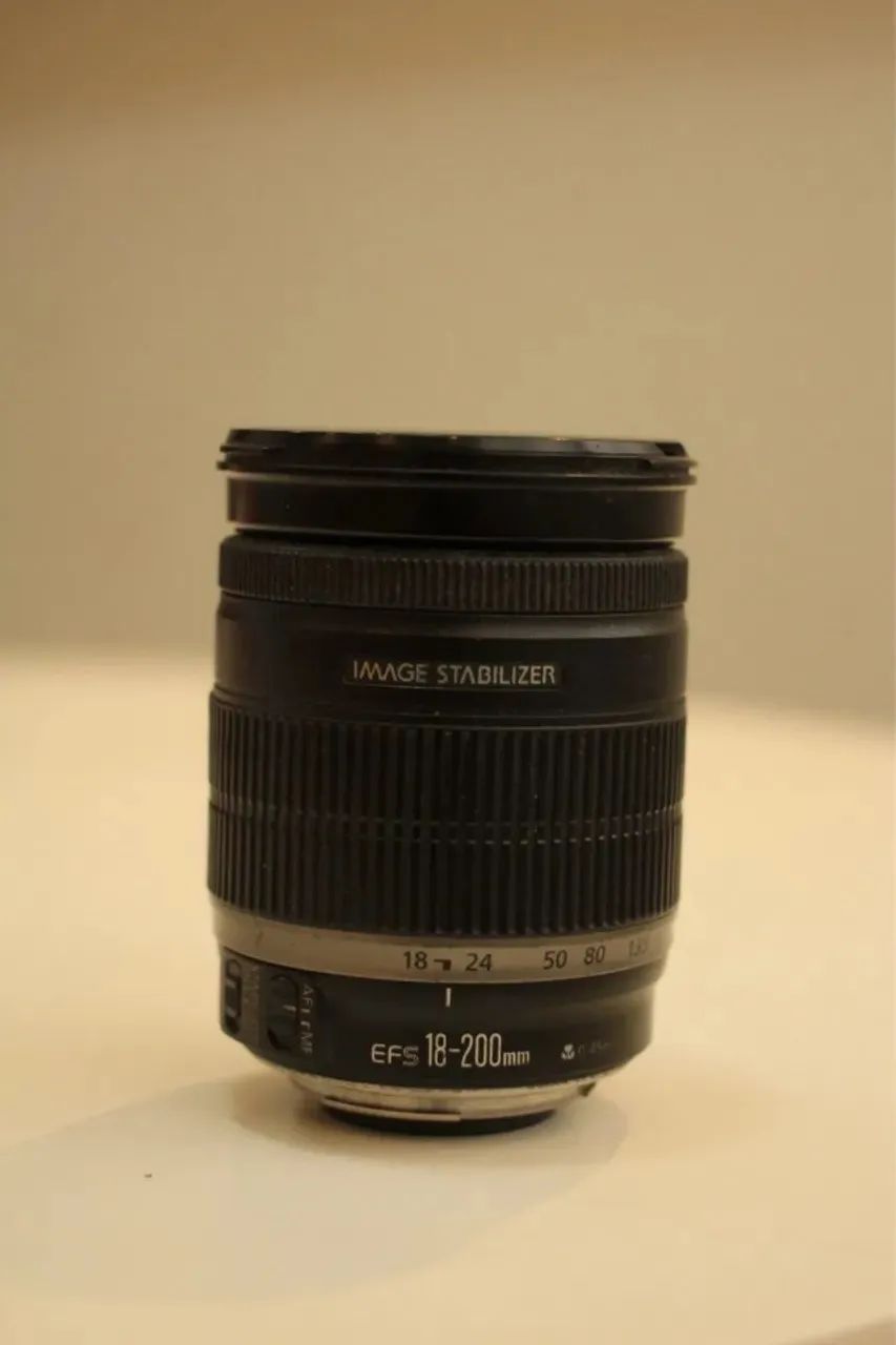 Troco em bateria e carregador para t5i - Canon 18-200 (manual)