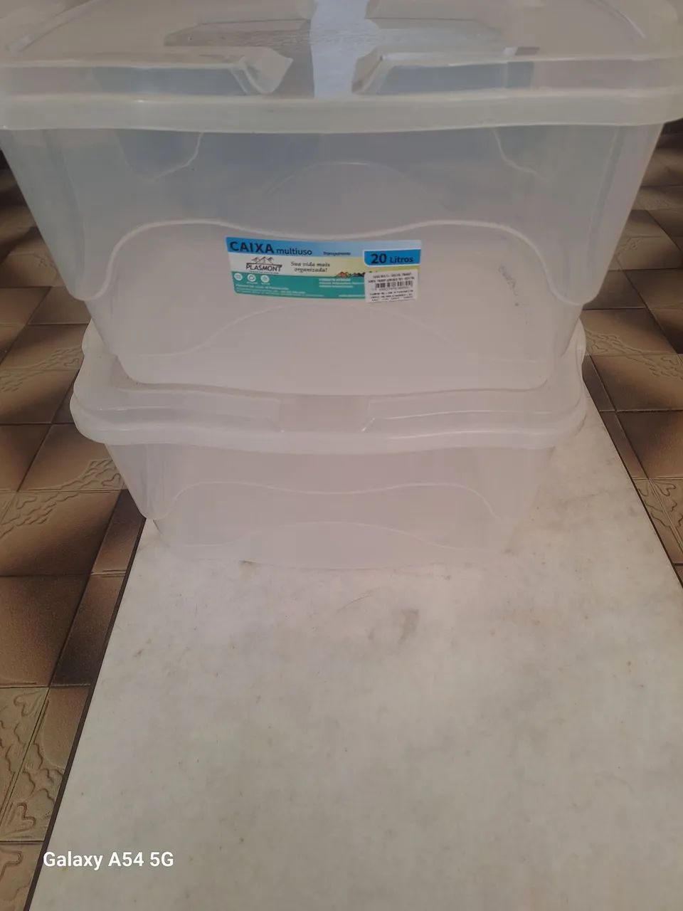 2 white storage boxes
