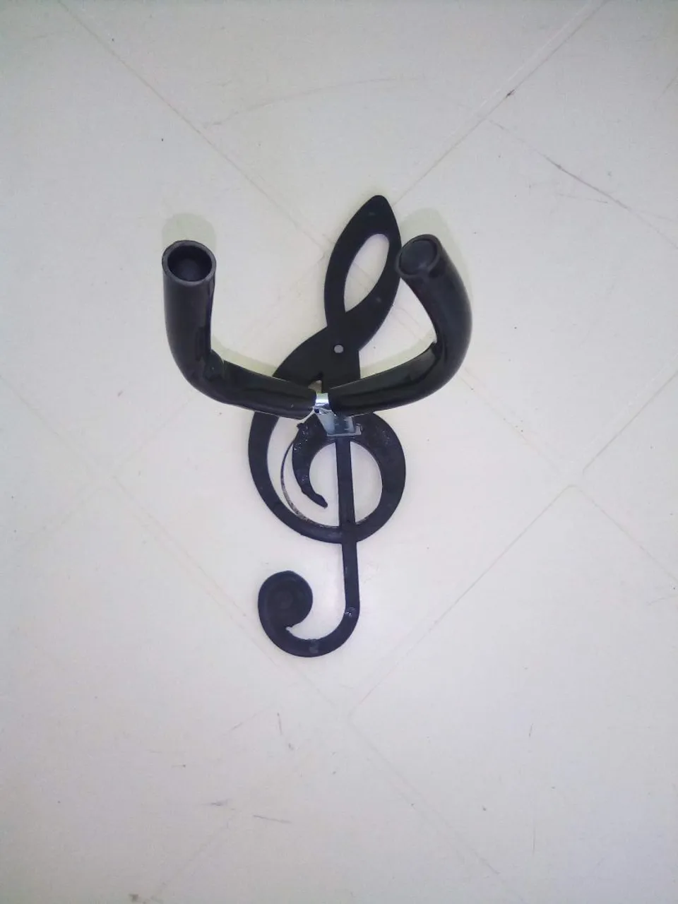 Suporte para instrumentos formato de clave de sol