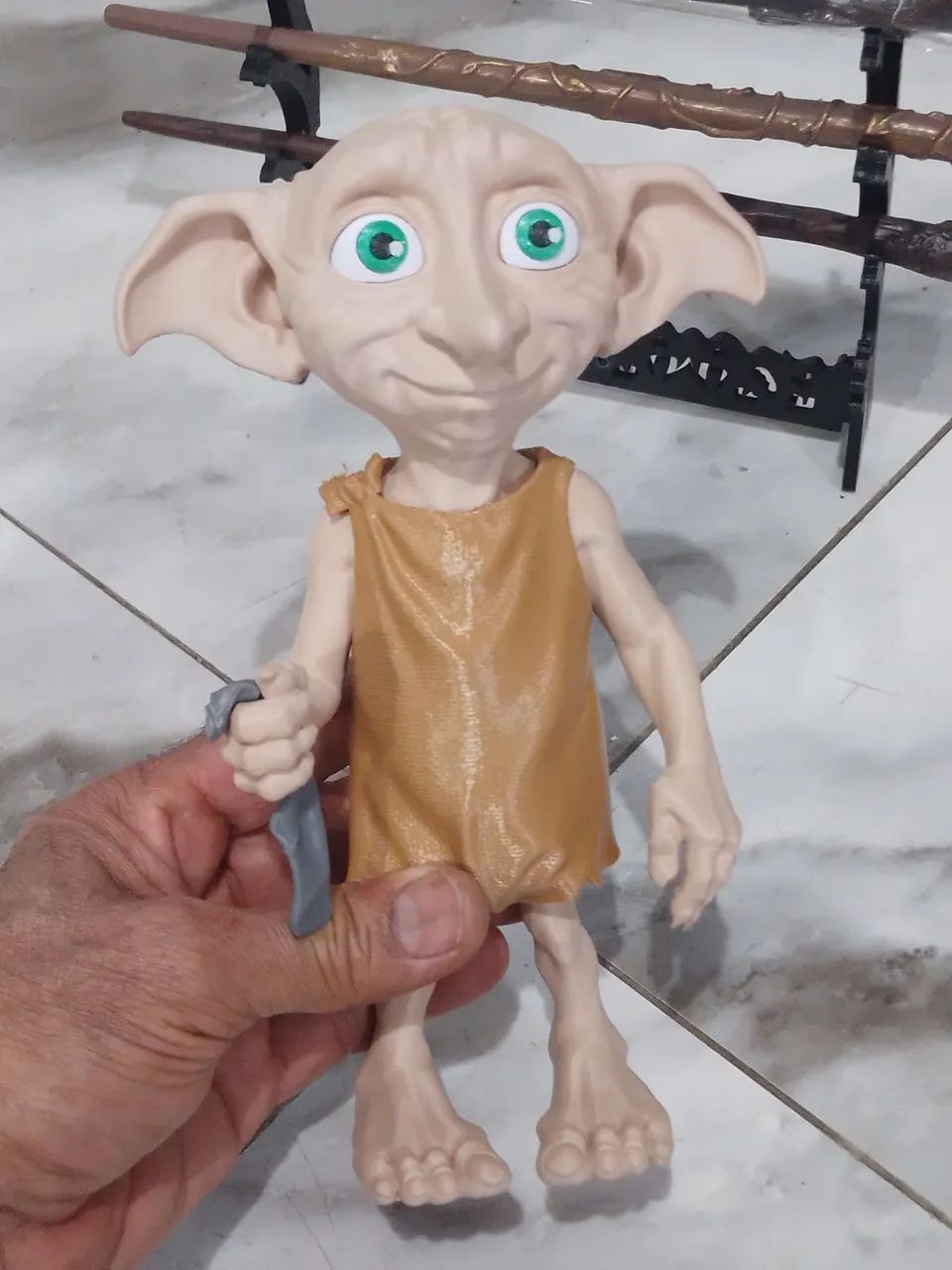 Boneco tobby e jogo de varinhas