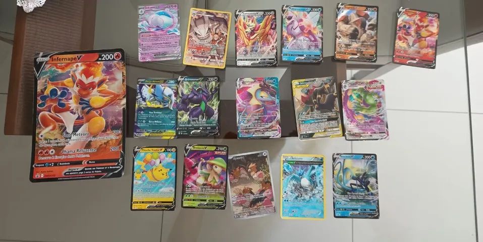 4 latas Pokémon + 1 pasta para guardar cartas - Foto 2