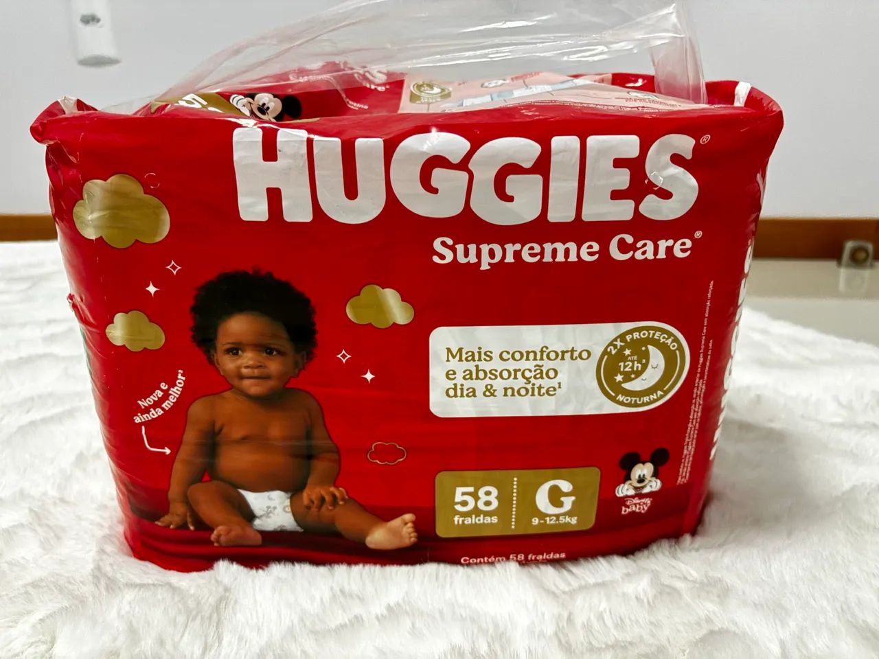Fralda supreme care Huggies G 58 unidades 
